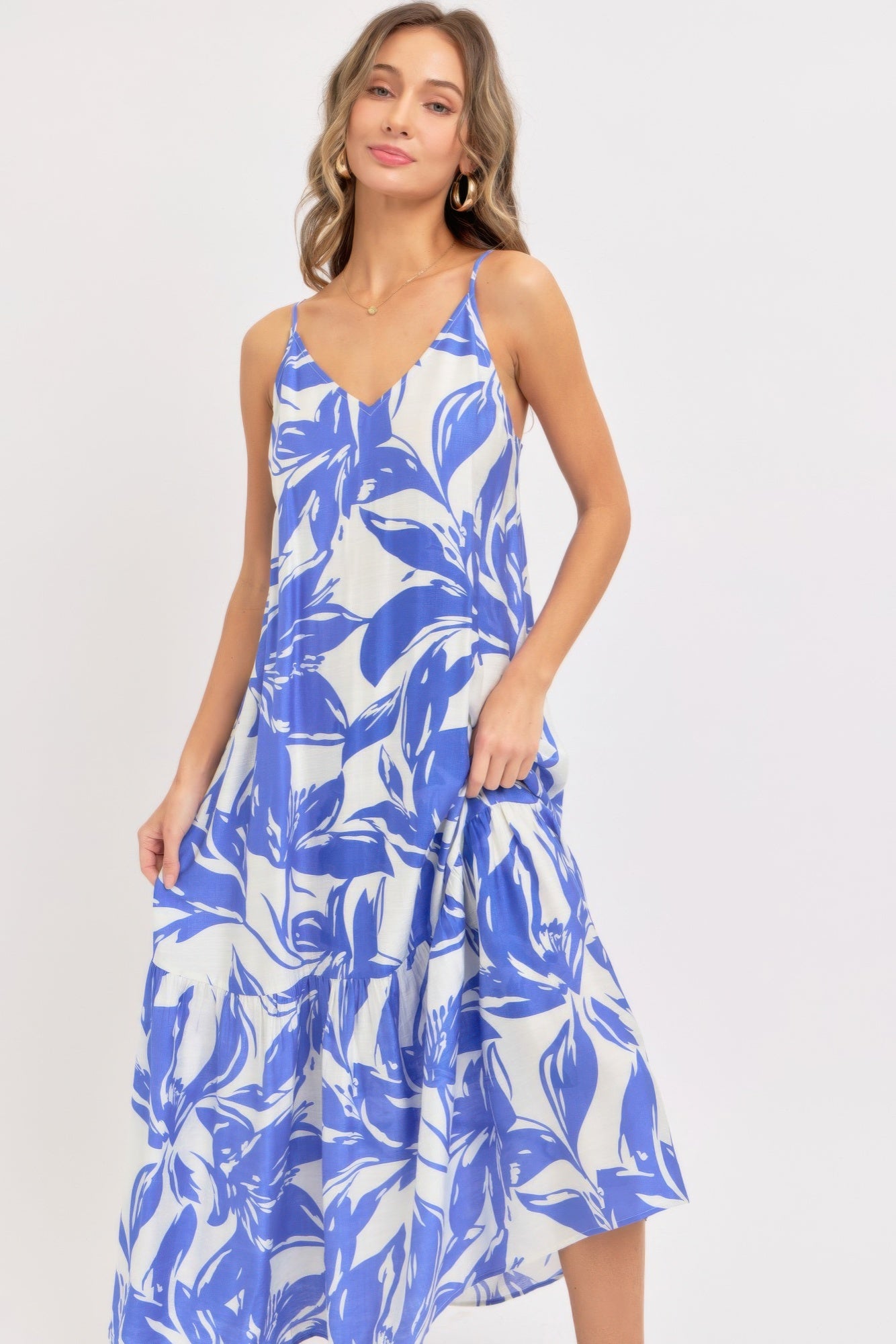 Close up of blue floral v neckline and thin straps
