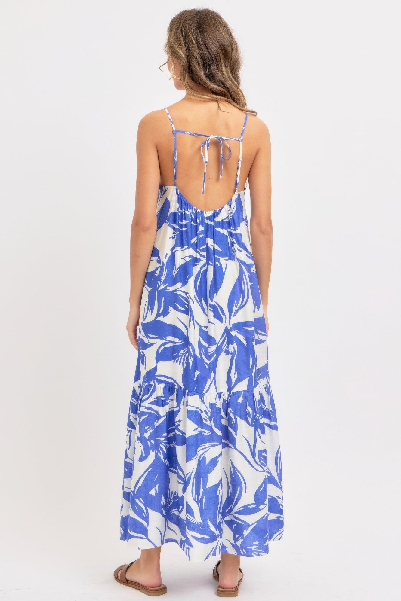 Back view of blue floral maxi dress with tie back detail