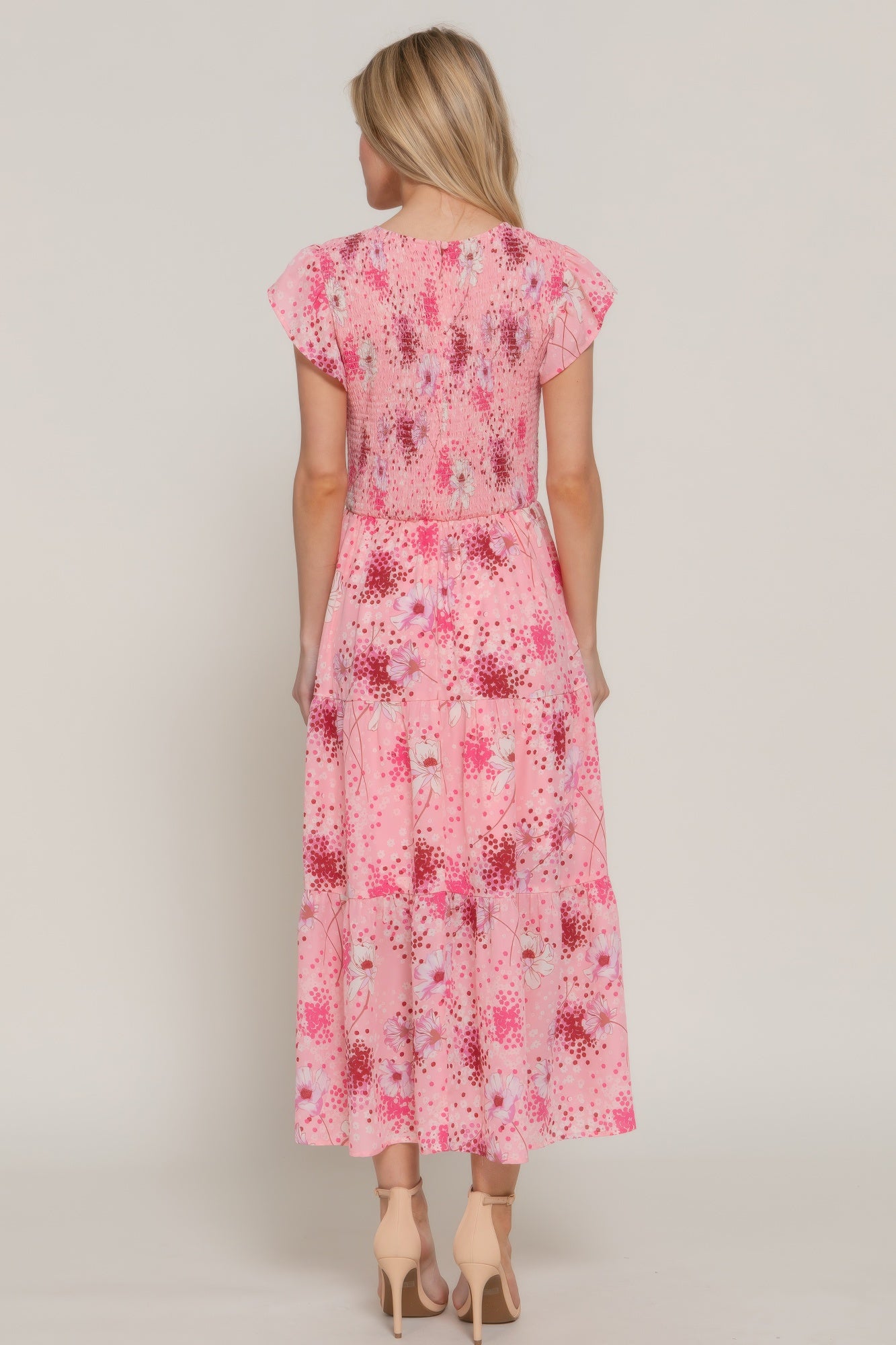 Back view of pink floral maxi dress with tiered skirt and smocked bodice-AVAH