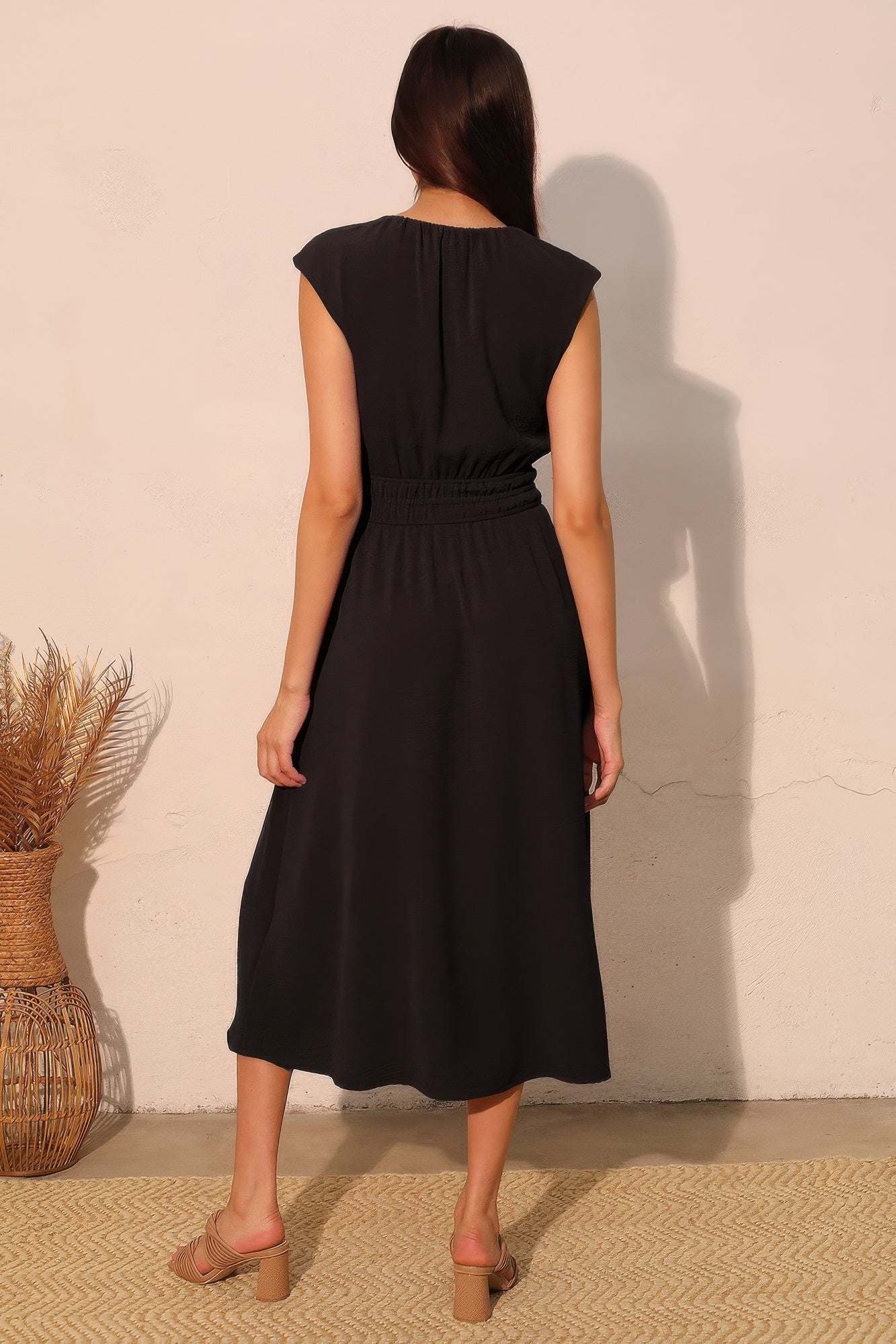 Back view of black made in USA midi dress