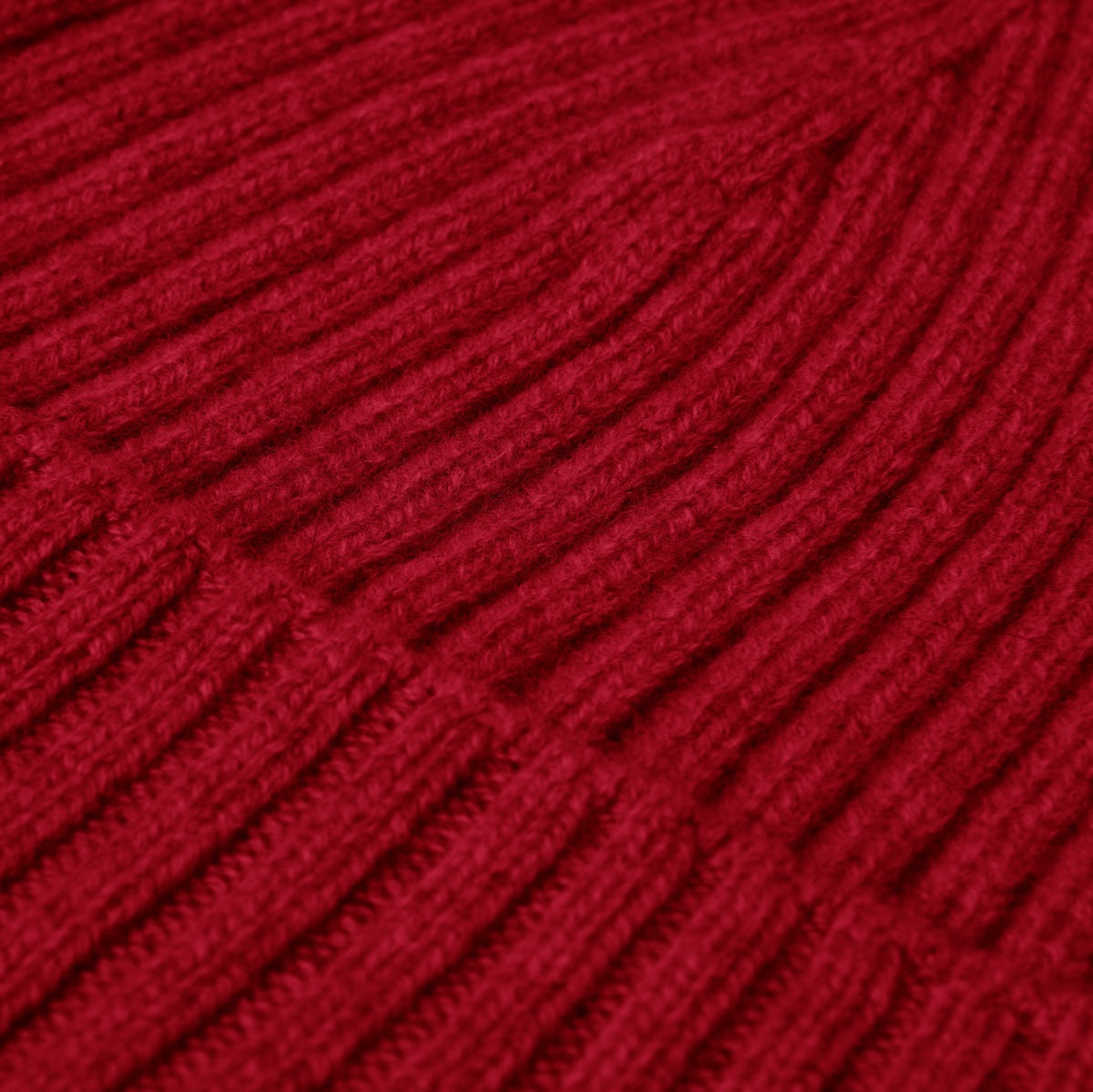 Close-up of red yarn with a textured pattern