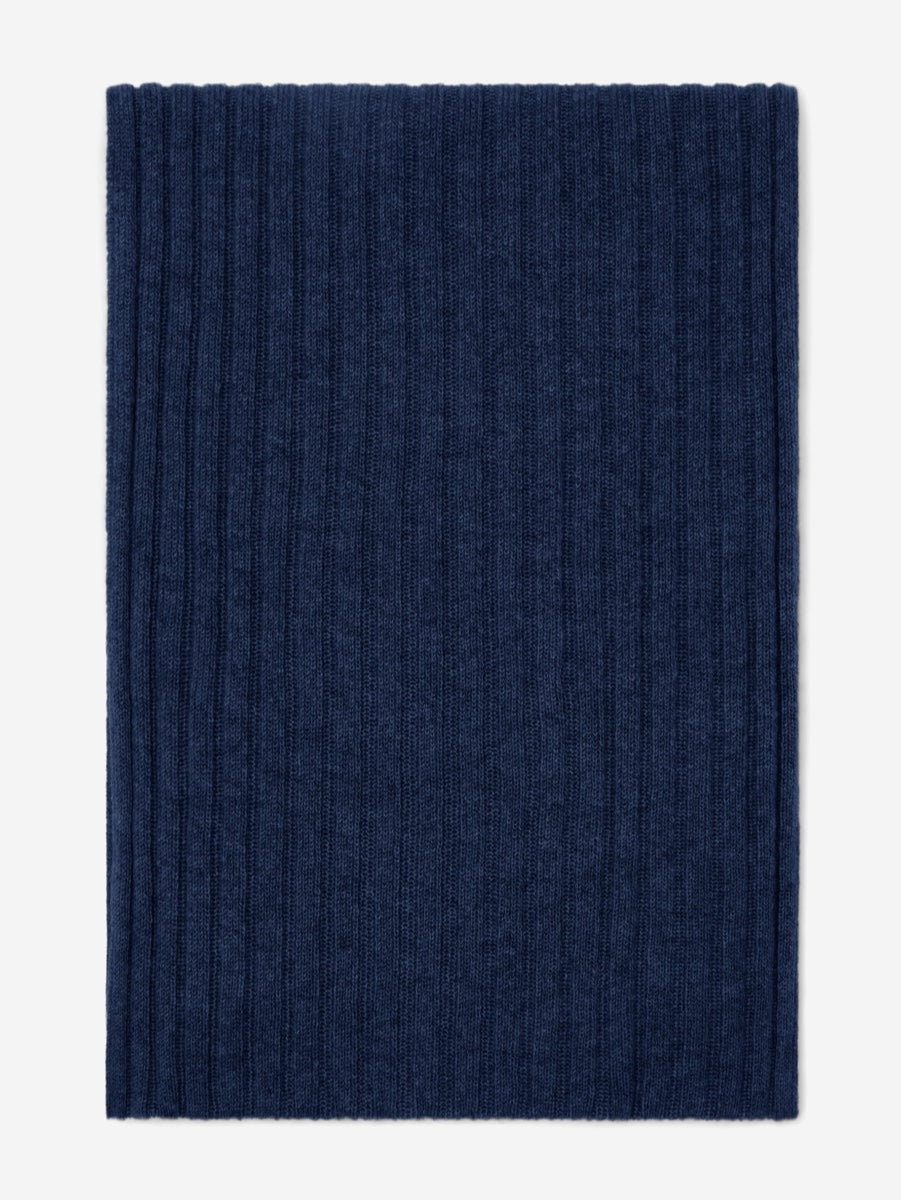 Navy blue knitted cashmere scarf on a white background