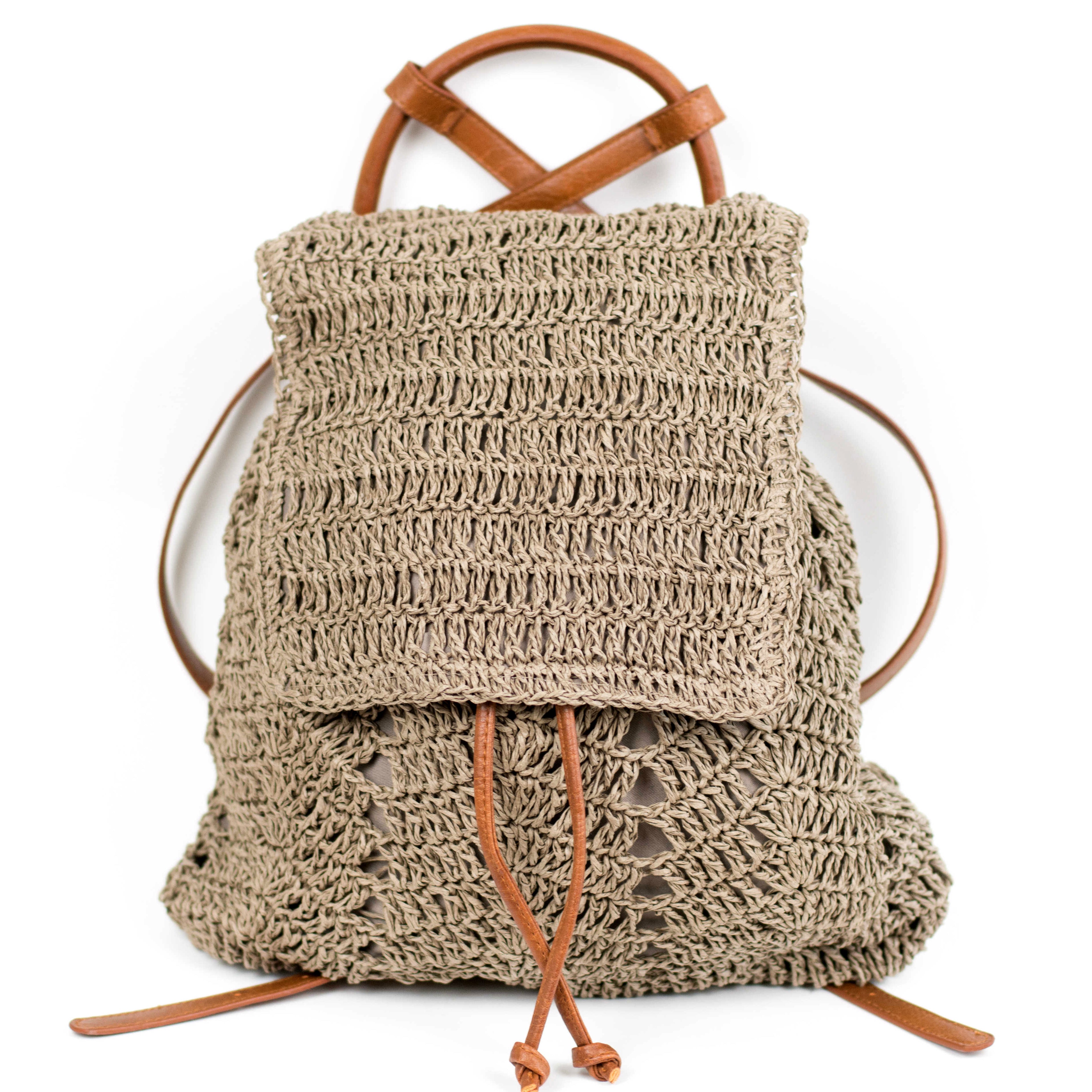 AVAH-closeup of dark khaki woven crochet backpack with brown leather straps front view