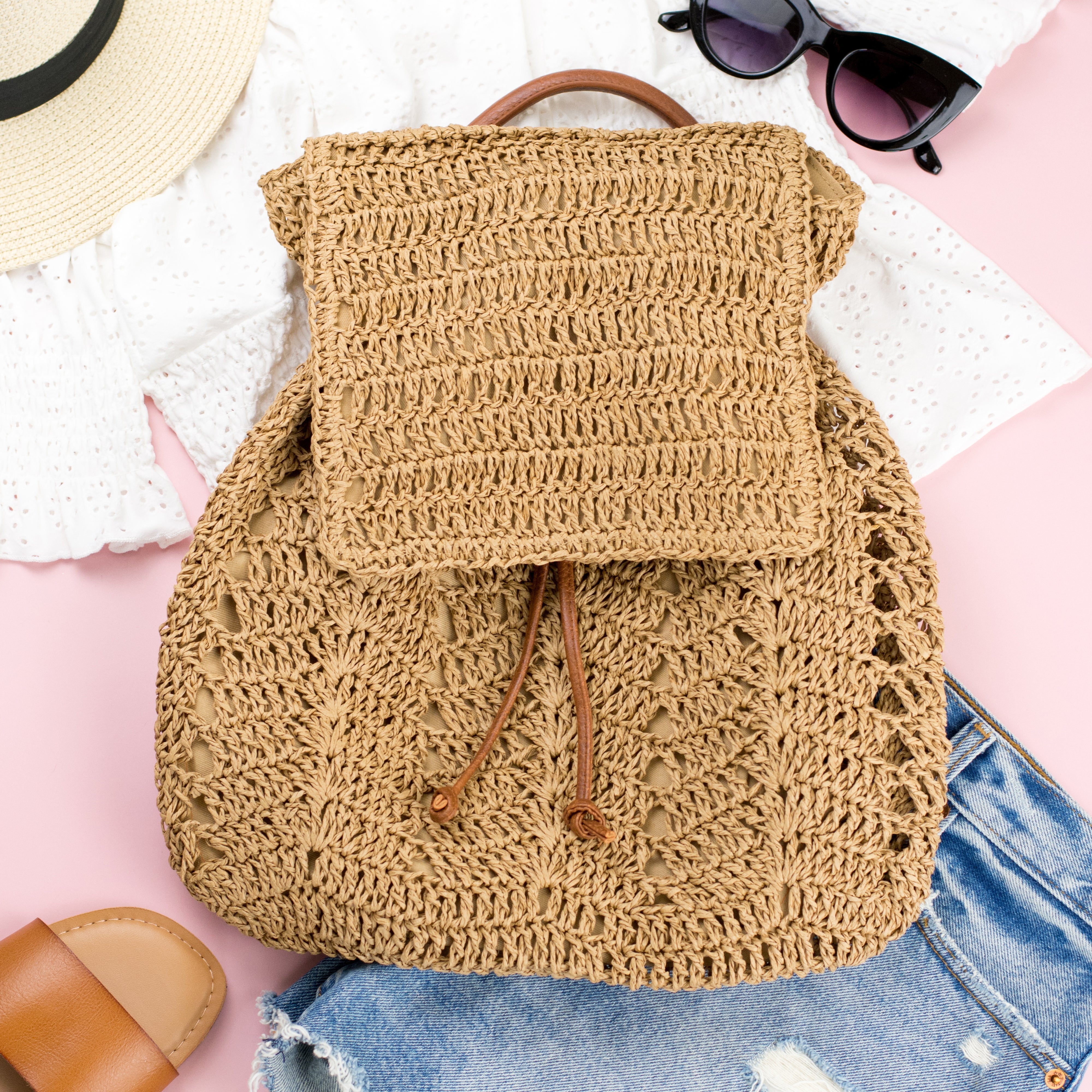 AVAH-front view khaki woven crochet backpack with brown leather straps