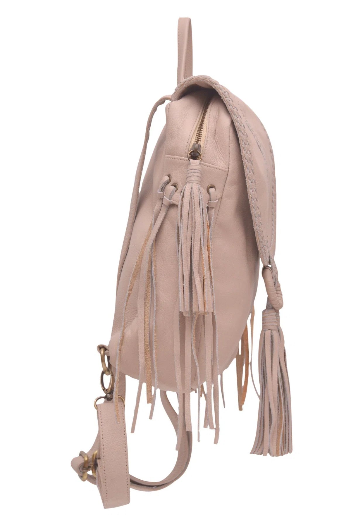 A light beige leather backpack with fringe details, braided straps, and a matching wristlet strap, shown from a side profile view on a white background.