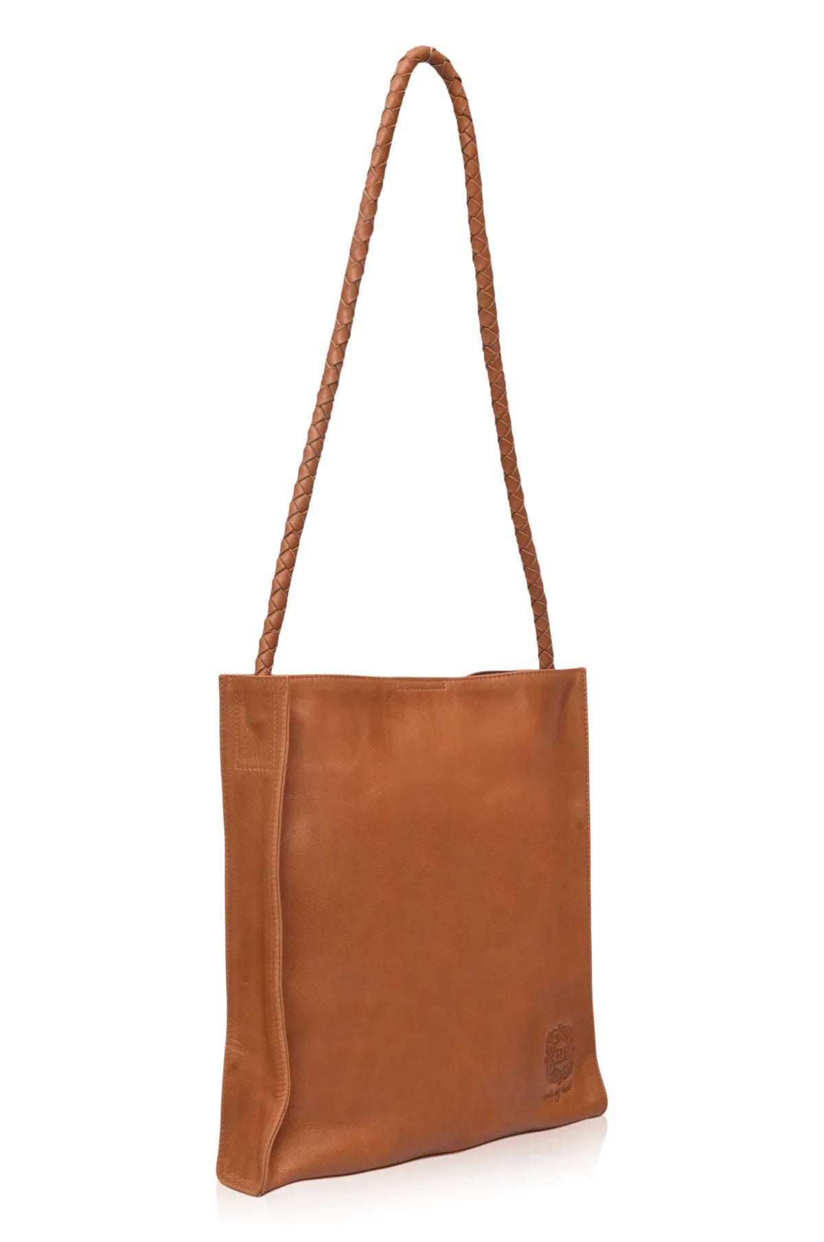 Tan leather tote bag with a rope handle on a white background
