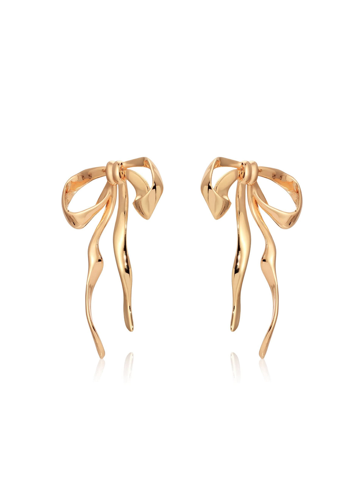 Angled view of gold-tone sculpted bow earrings showing post closures.