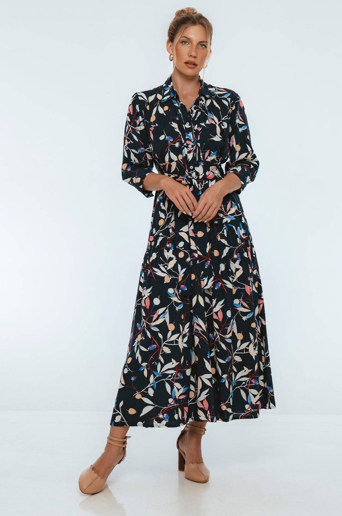 Woman wearing a floral dress on a white background