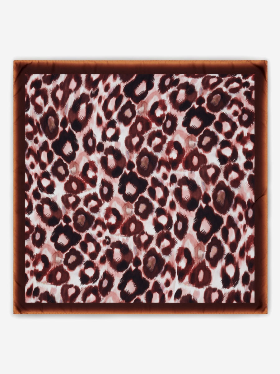 Leopard print pattern silk scarf on a white background
