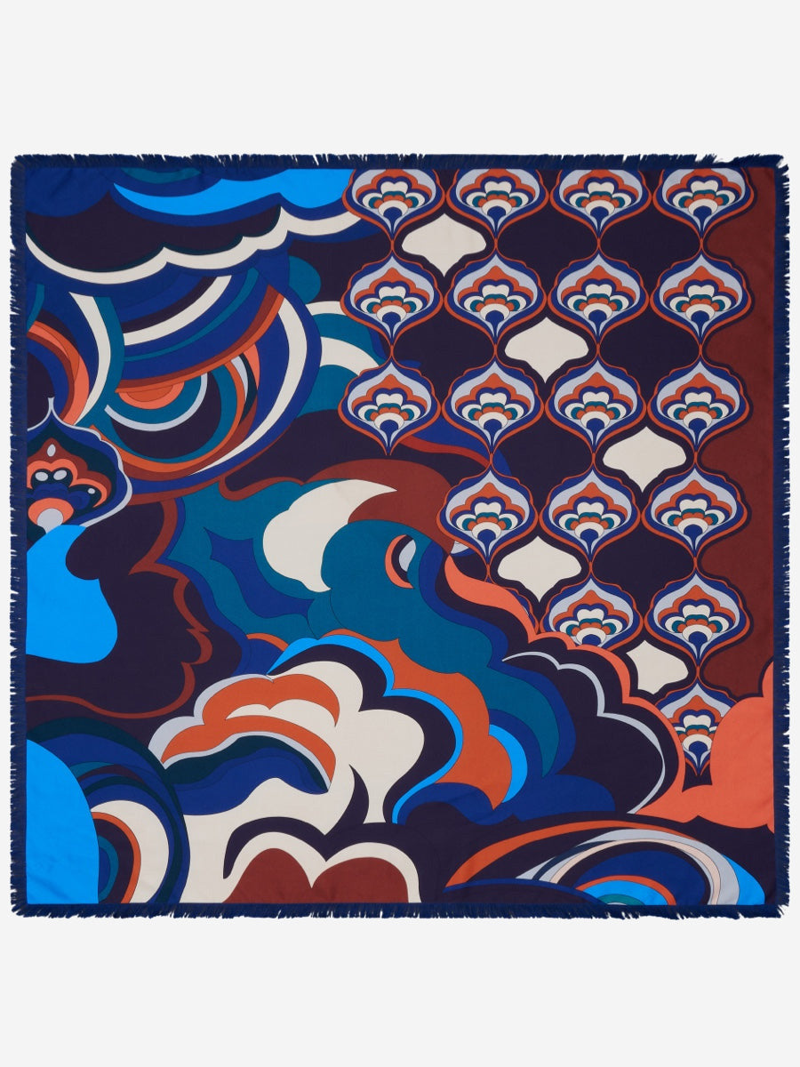 Colorful patterned fabric with abstract designs on a white background