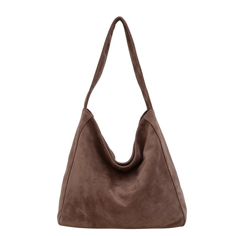 Dark Brown suede handbag on a white background