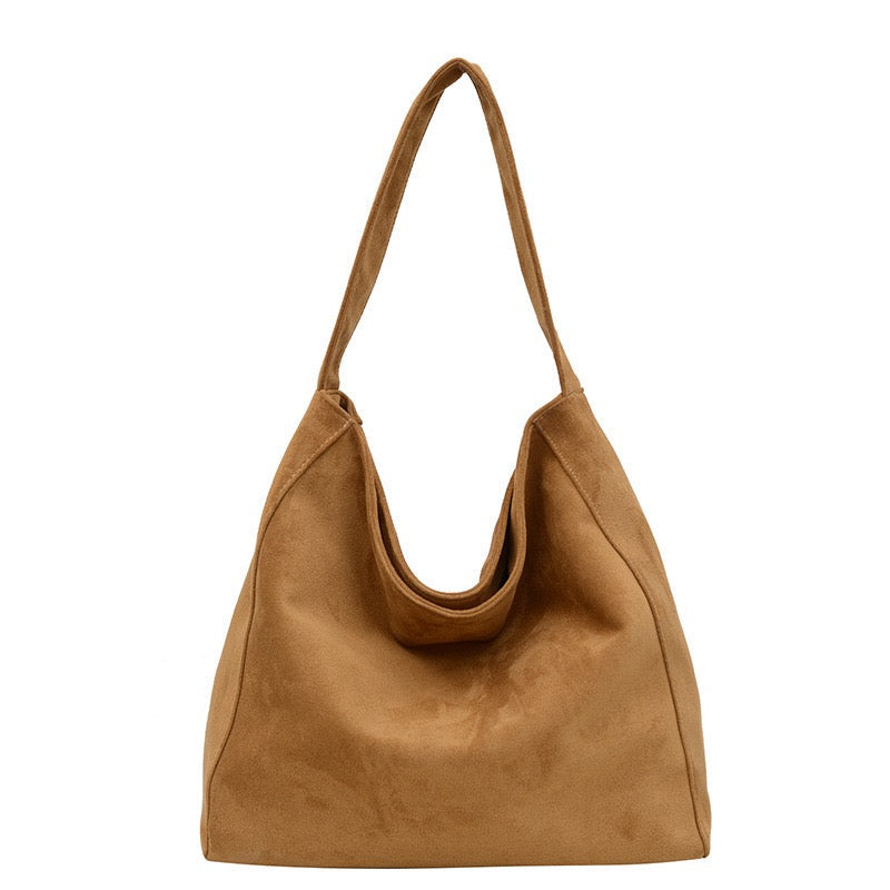 Camel handbag on a white background