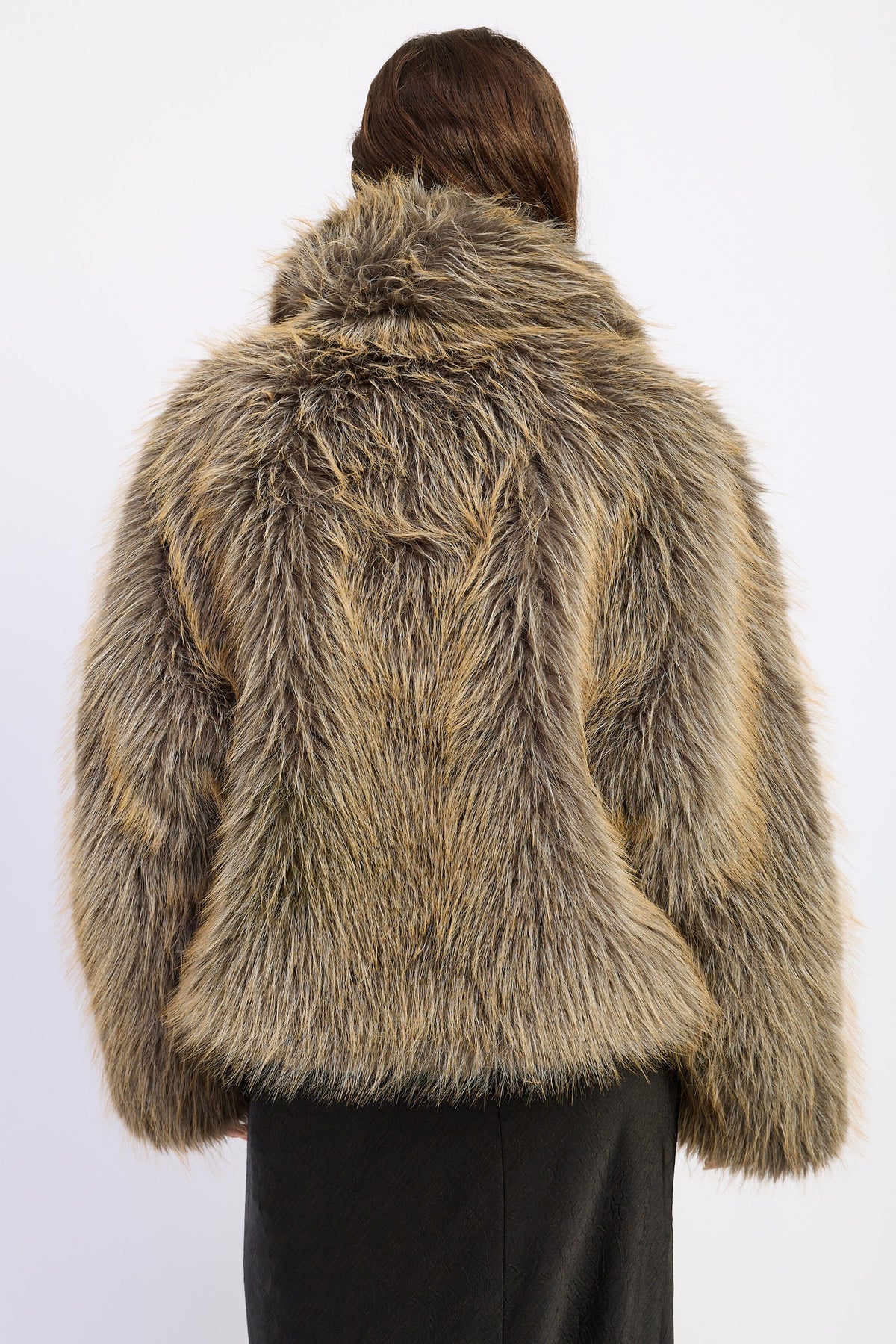 Back view of Montana Wild Faux Fur Coat featuring mixed earthy tones and relaxed hip length silhouette.