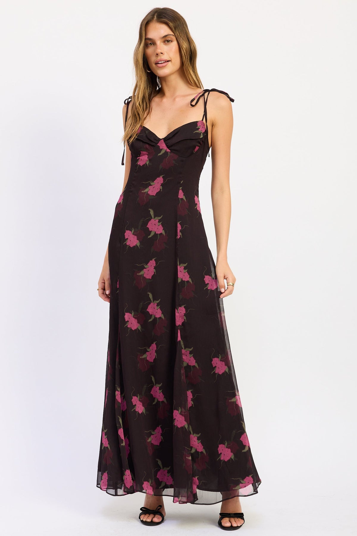 Alessandra Floral Maxi Dress in black with pink flowers, sweetheart neckline, tie shoulder straps and flowing skirt, front view.