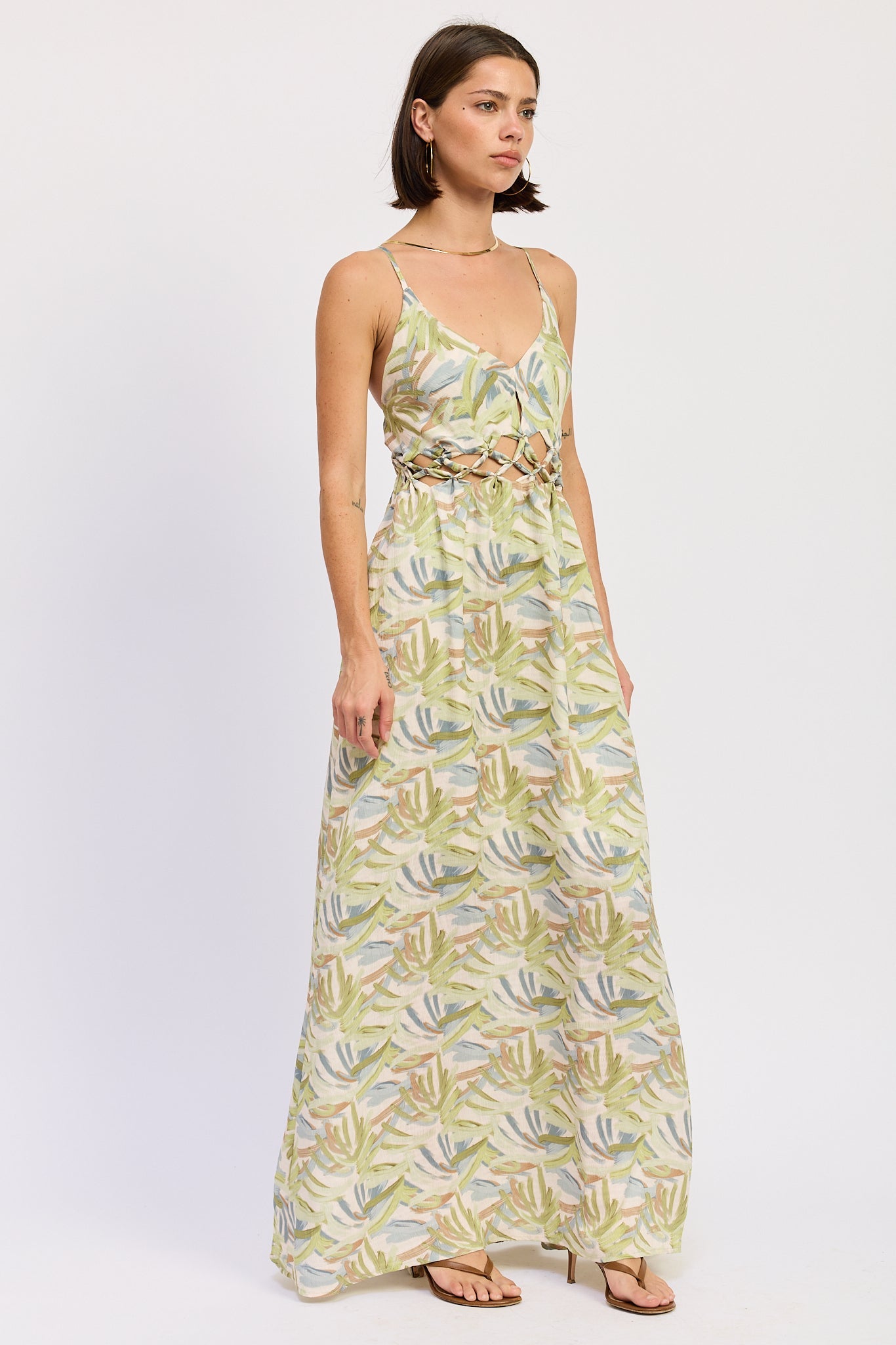Green tropical print cutout maxi dress with V neckline and flowing skirt