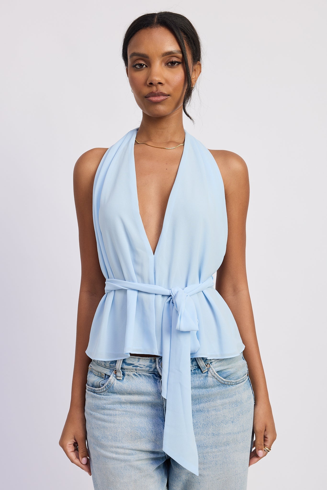 Light blue halter top with deep V neckline and tie waist front view