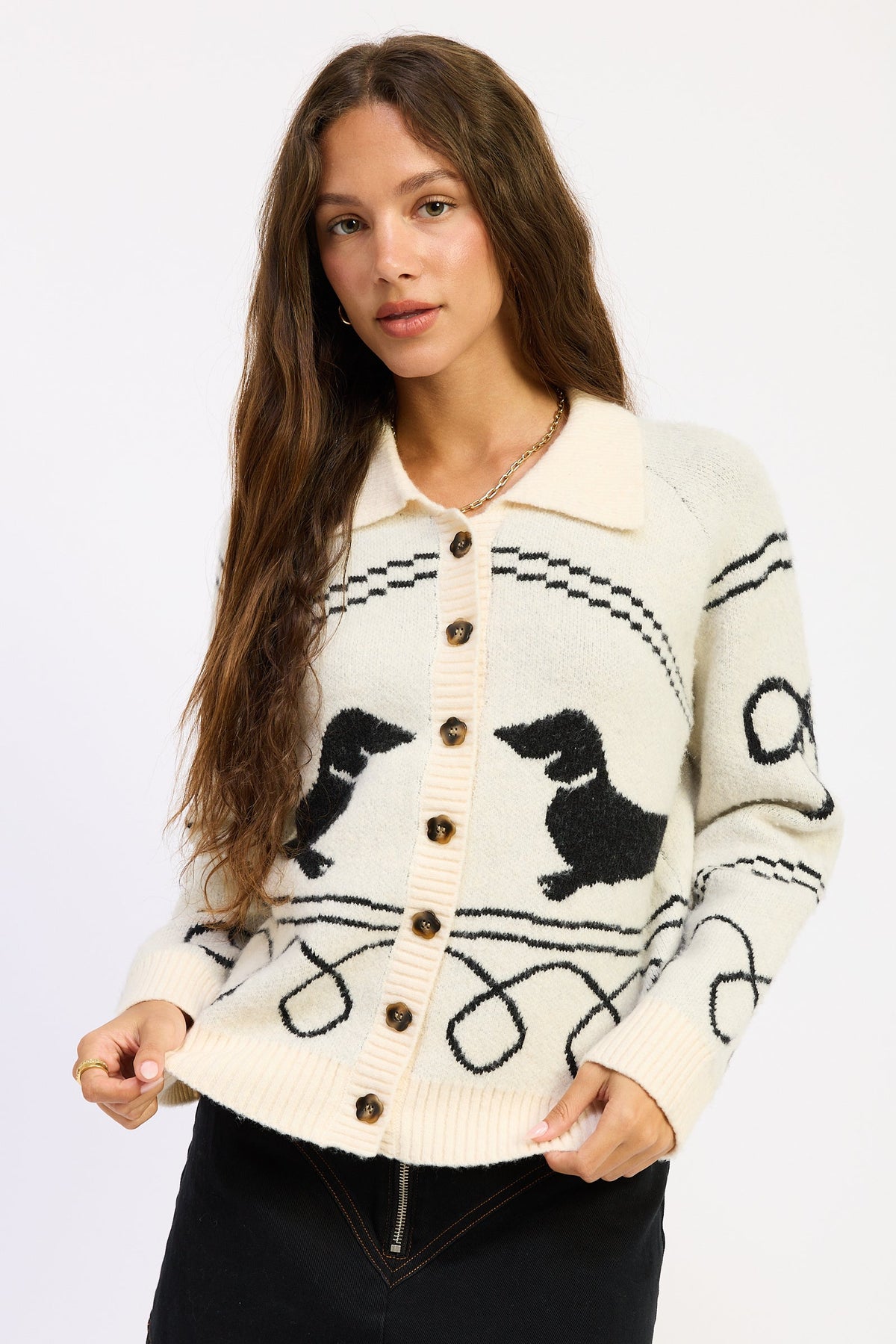 Doxie Darling Dachshund Cardigan in ivory and black with two dachshund dogs, collared neckline and button front.