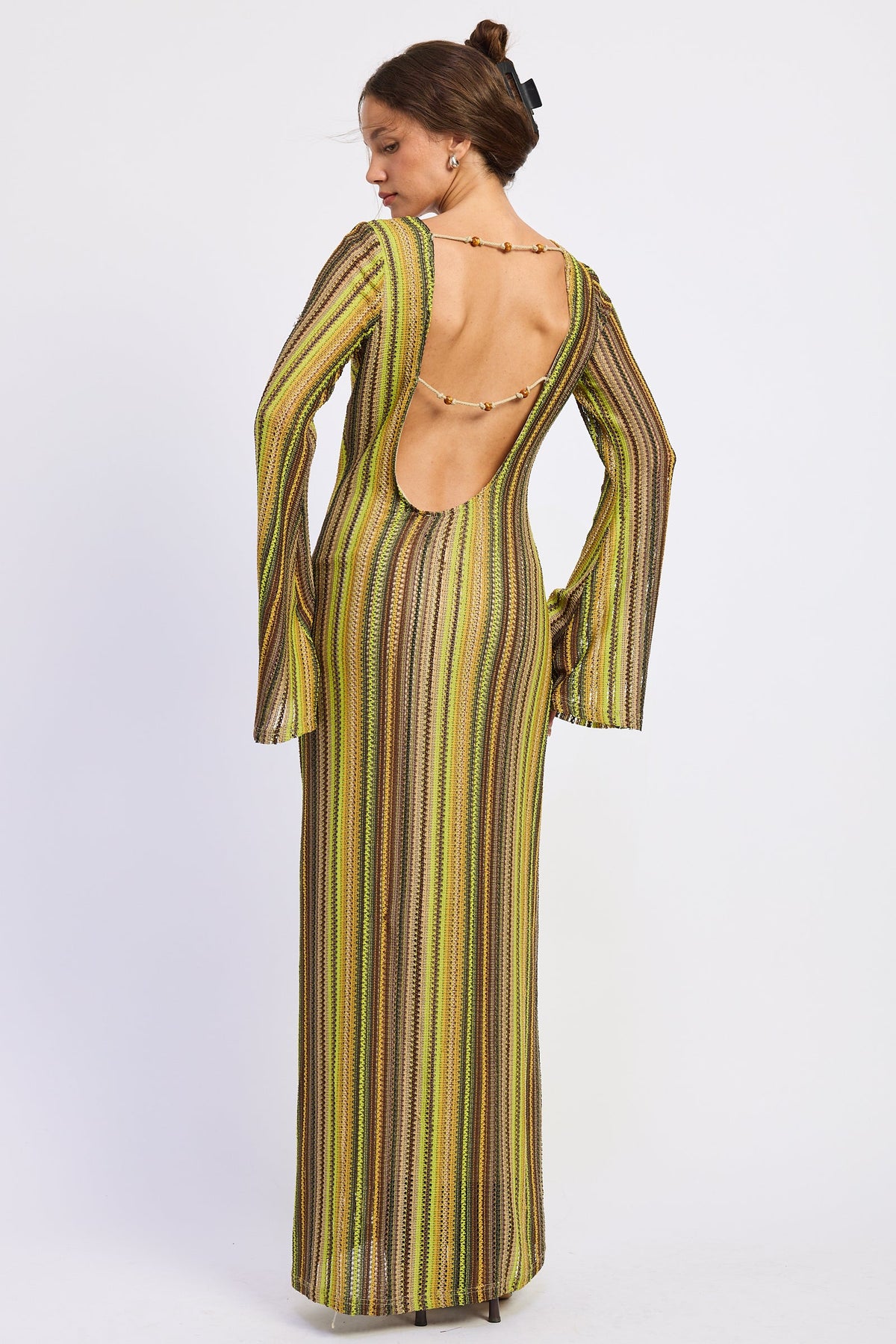 Back view of Solstice Stripe Long Sleeve Maxi Dress featuring a deep scoop open back with delicate decorative beaded straps.