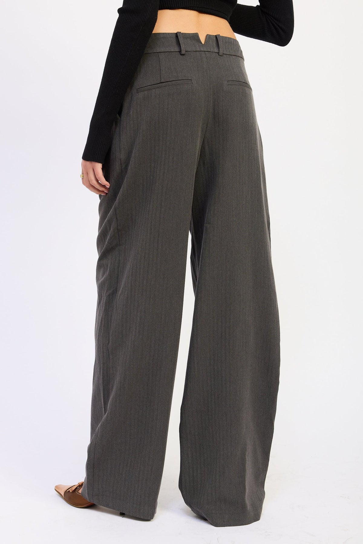 Back view of Madison Wide Leg Trousers in charcoal gray showing wide leg silhouette, belt loops and back welt pocket detailing.
