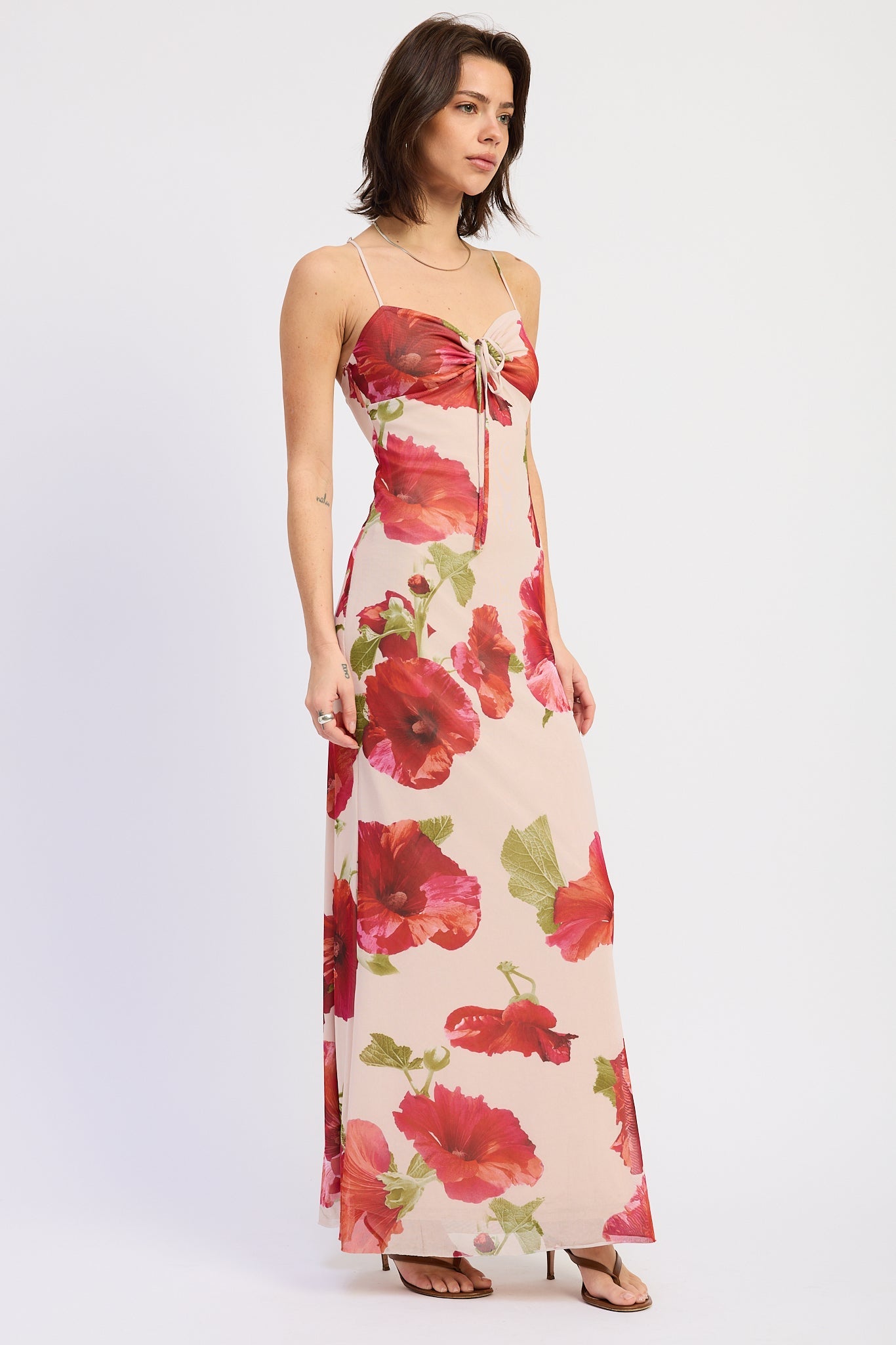 Side view of cream bold floral maxi dress with fitted silhouette and open back straps, AVAH