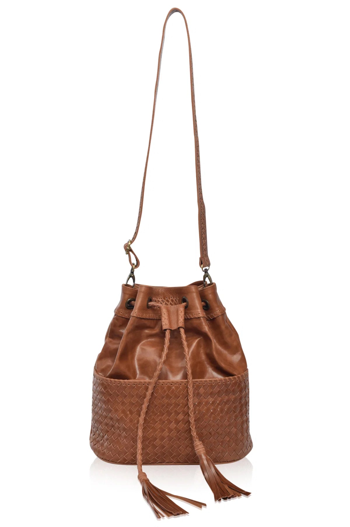 Camel leather woven backpack with braded drawstring opening and braided adjustable straps converted to crossbody with brass hardware on the front on white background, front view