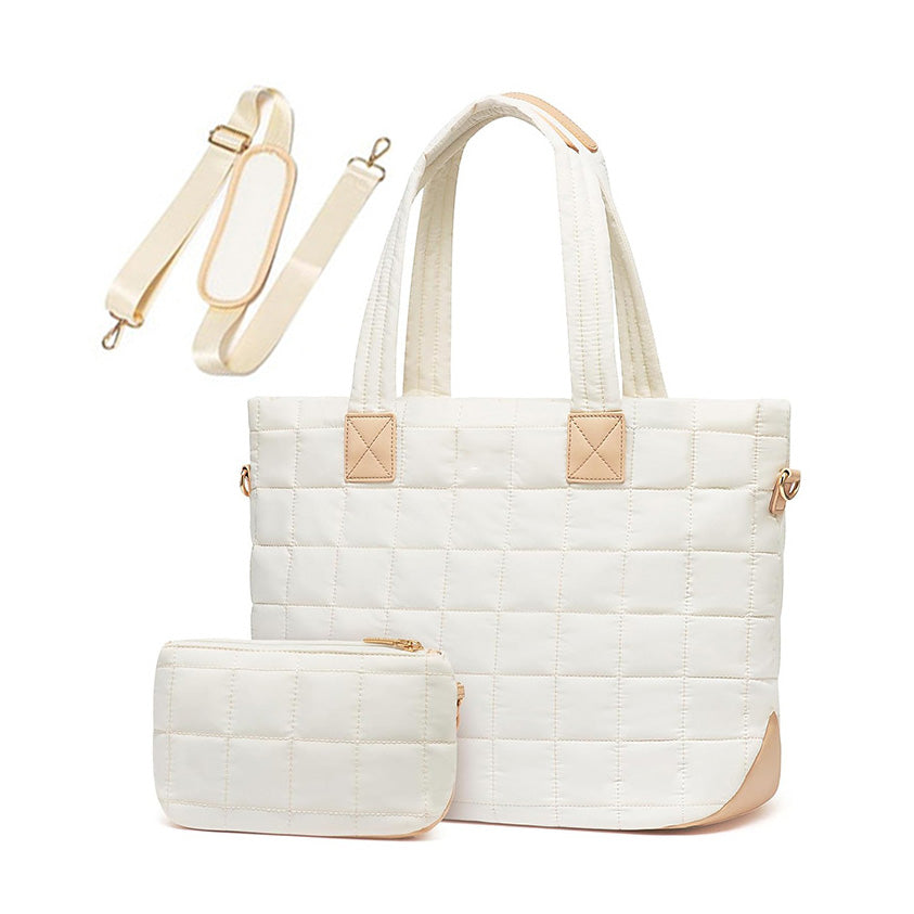 White quilted tote bag with matching pouch on a white background