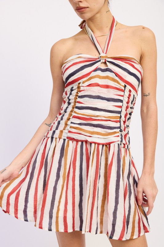 Woman wearing a striped halter mini dress front view with multicolor vertical stripes on a white background front view closeup