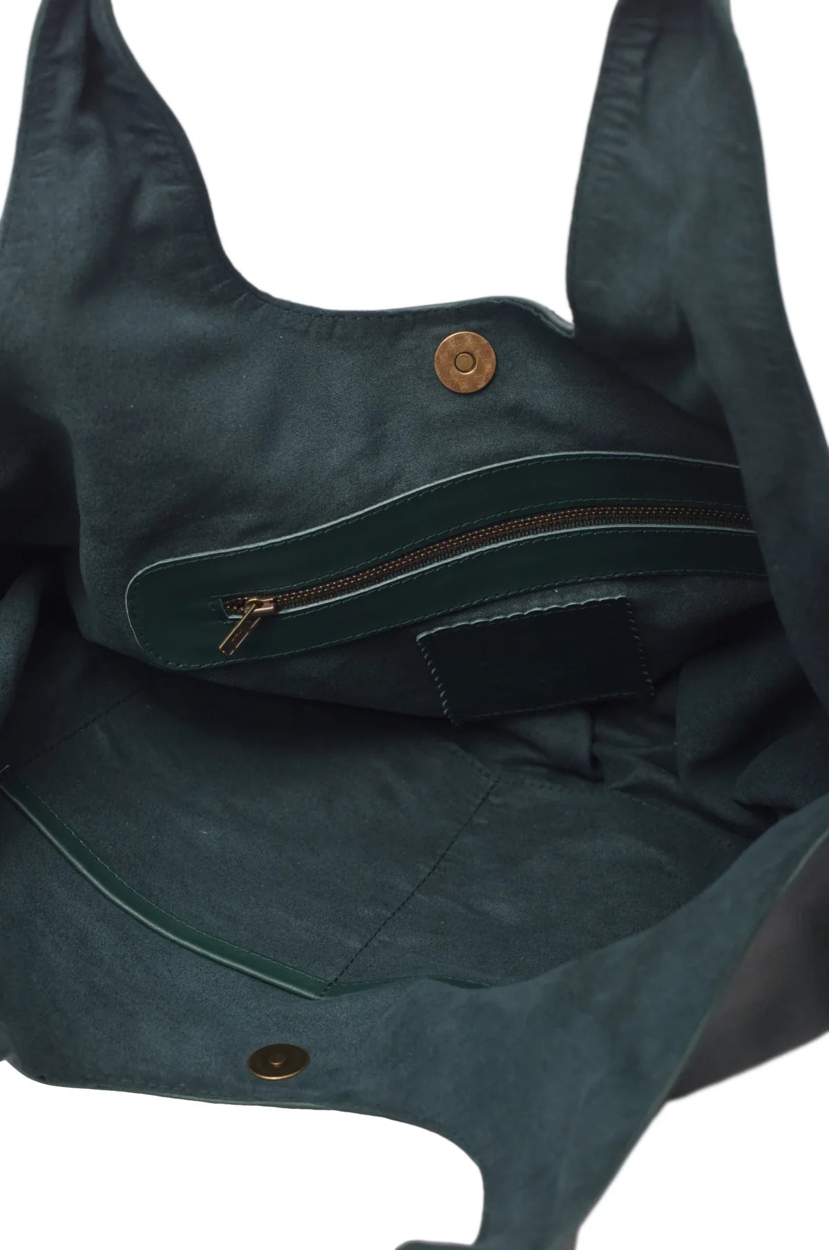 Closeup of the green suede lined geen leather bag with a zipper pocket on a white background