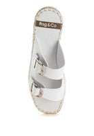 Top-down view of white leather espadrille sandal with two silver buckles