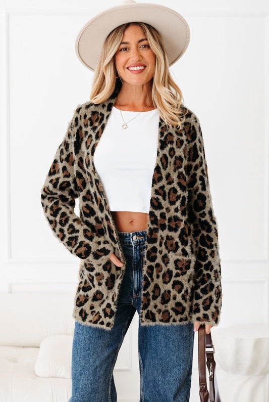 Front view of leopard print knit cardigan styled with white crop top and jeans-AVAH