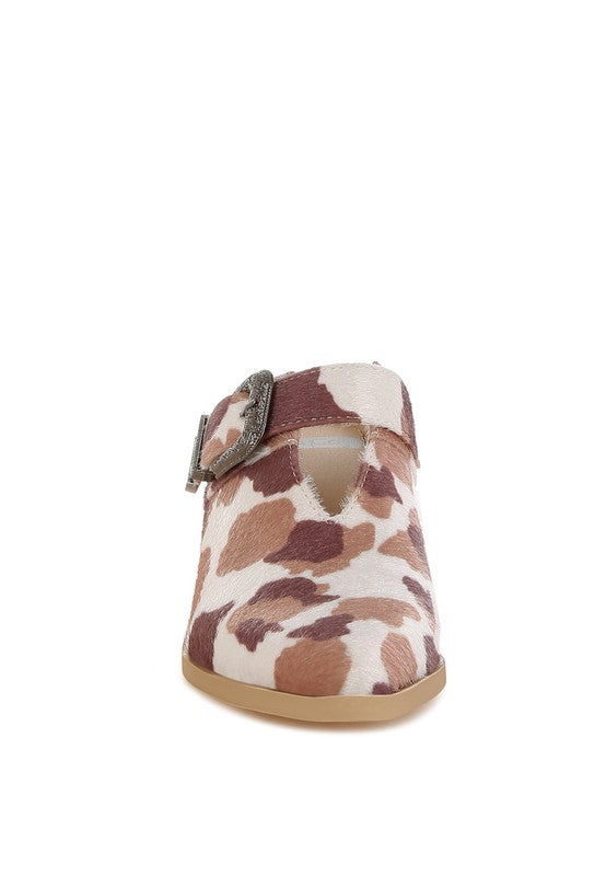 Front view highlighting pointed toe and cut-out detail of the mule