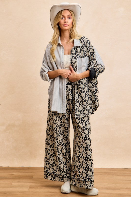 Florence Mixed Print Button Down Shirt with cream floral print, gray striped panels and contrasting chest pocket, styled with matching floral pants.