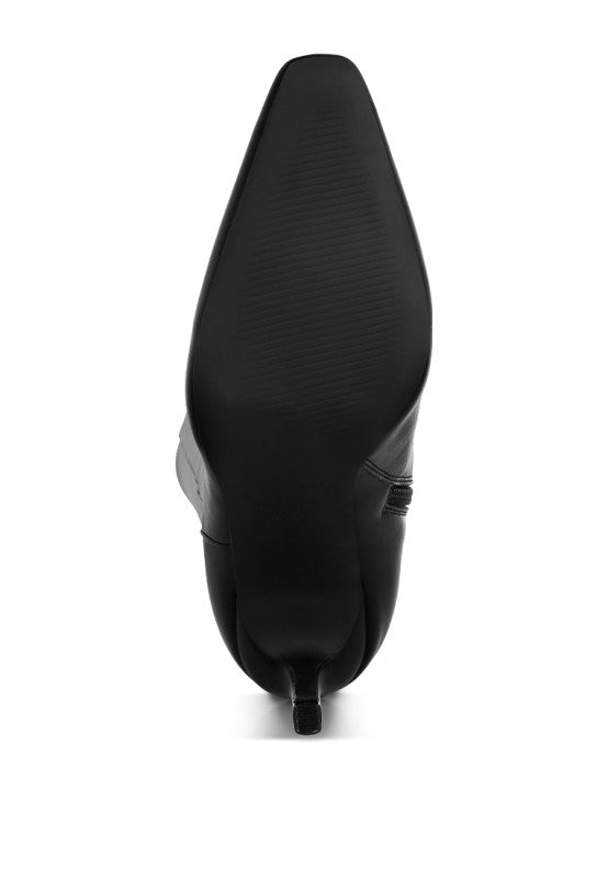 Black boot on a white background showing the sole