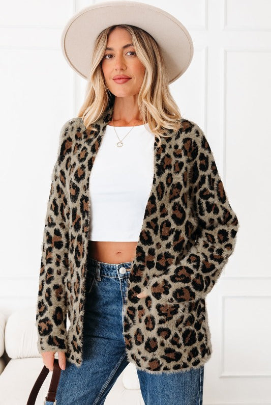 Side angle of open-front leopard cardigan showing relaxed fit.