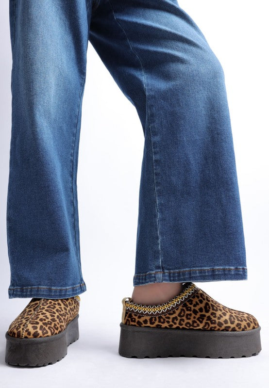 full outfit view of leopard print platform shoes and jeans