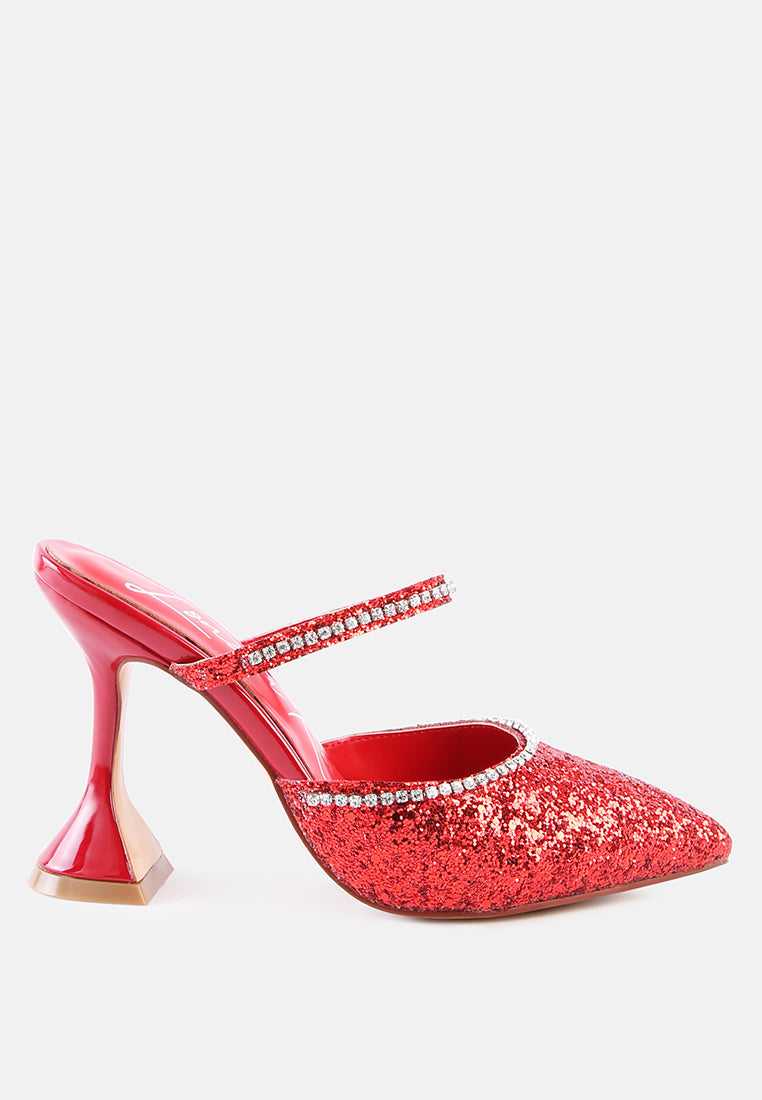 red glitter mules with rhinestone embellishment, sculpted heel, pointed toe and crystal decorated elastic strap Side view