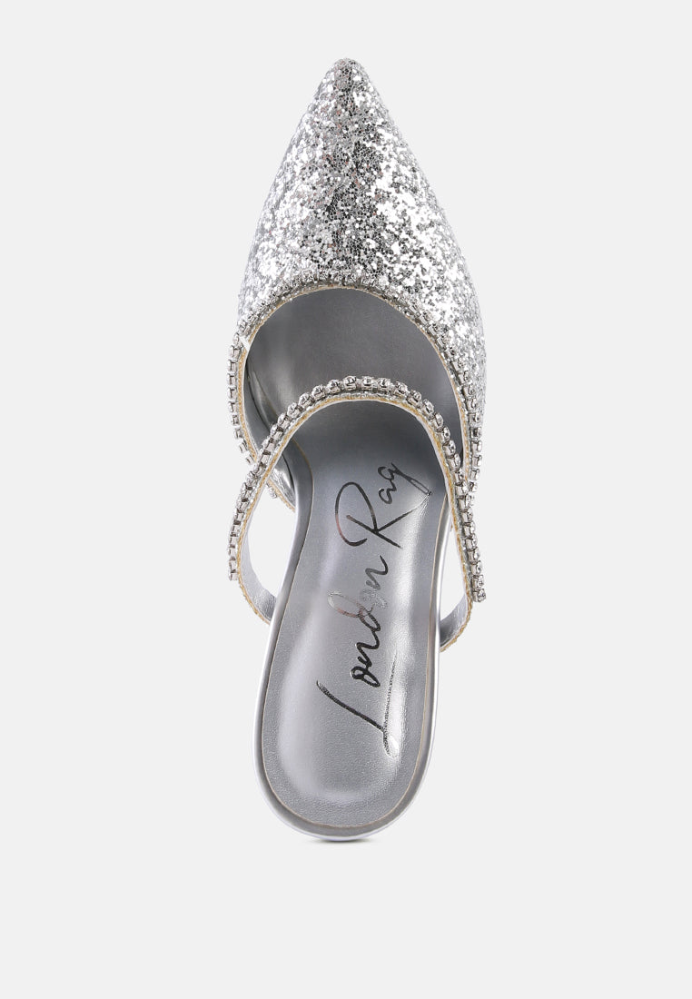 Silver Glitter mules with rhinestone embellishment, sculpted heel, pointed toe and crystal decorated elastic strap top view