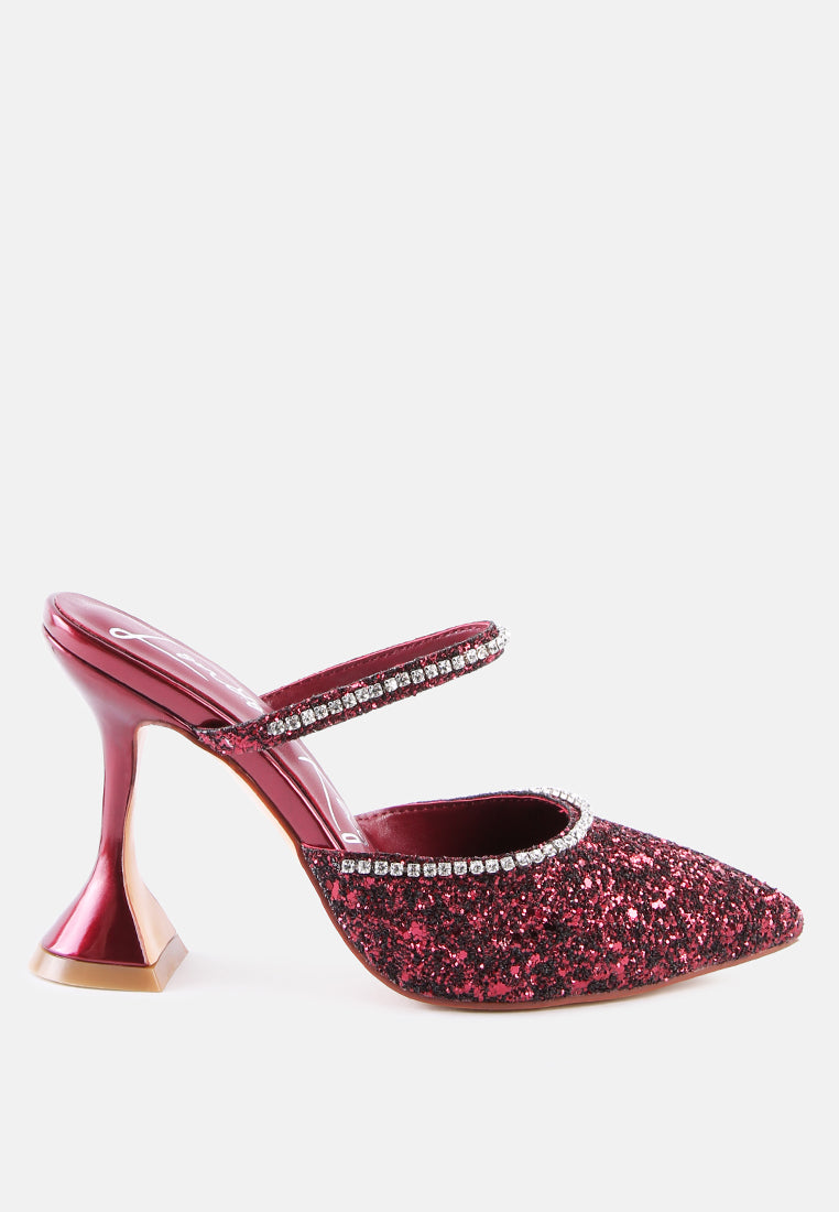 Wine color glitter mules with rhinestone embellishment, sculpted heel, pointed toe and crystal decorated elastic strap Side view