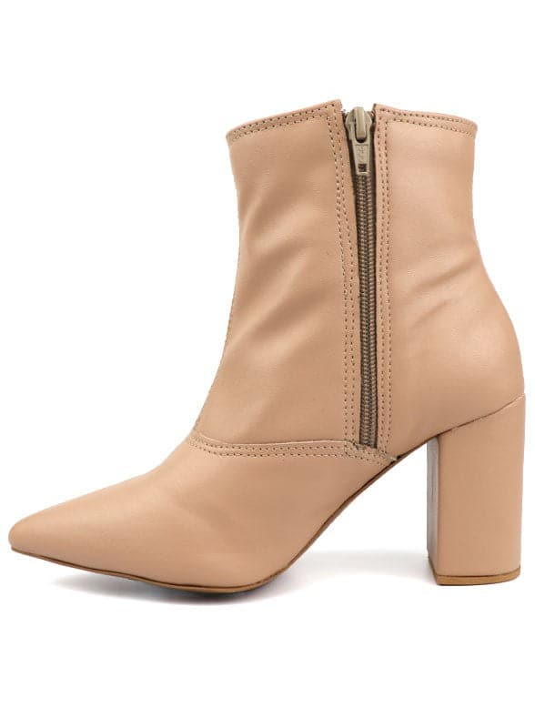 This pointed toe bootie is a chic and comfortable must have for fall. With its side zip closure, pointy toe and block heel this pair is ideal for your everyday needs. Pair it with your favorite look while the weather turns chilly! Avah Couture