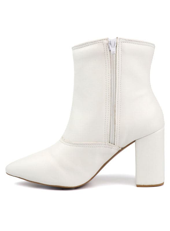 This pointed toe bootie is a chic and comfortable must have for fall. With its side zip closure, pointy toe and block heel this pair is ideal for your everyday needs. Pair it with your favorite look while the weather turns chilly! Avah Couture