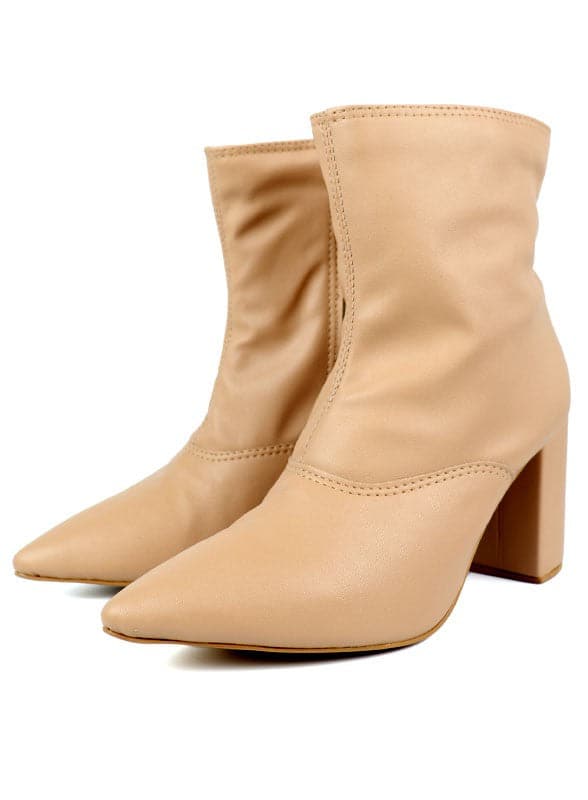 This pointed toe bootie is a chic and comfortable must have for fall. With its side zip closure, pointy toe and block heel this pair is ideal for your everyday needs. Pair it with your favorite look while the weather turns chilly! Avah Couture