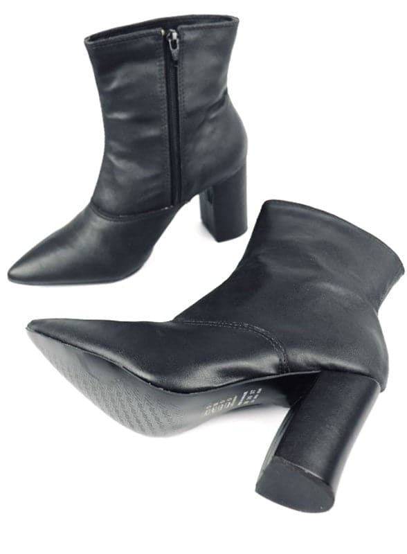 This pointed toe bootie is a chic and comfortable must have for fall. With its side zip closure, pointy toe and block heel this pair is ideal for your everyday needs. Pair it with your favorite look while the weather turns chilly! Avah Couture