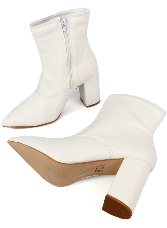 This pointed toe bootie is a chic and comfortable must have for fall. With its side zip closure, pointy toe and block heel this pair is ideal for your everyday needs. Pair it with your favorite look while the weather turns chilly! Avah Couture