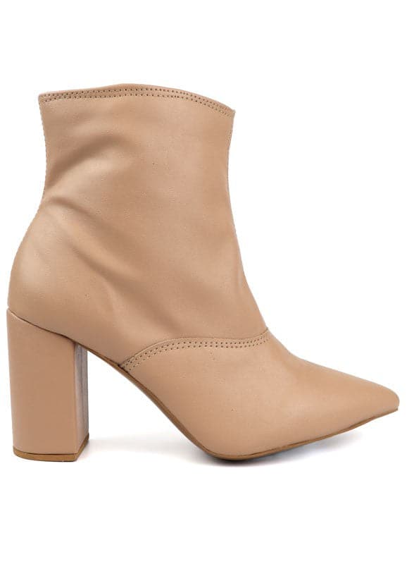 This pointed toe bootie is a chic and comfortable must have for fall. With its side zip closure, pointy toe and block heel this pair is ideal for your everyday needs. Pair it with your favorite look while the weather turns chilly! Avah Couture