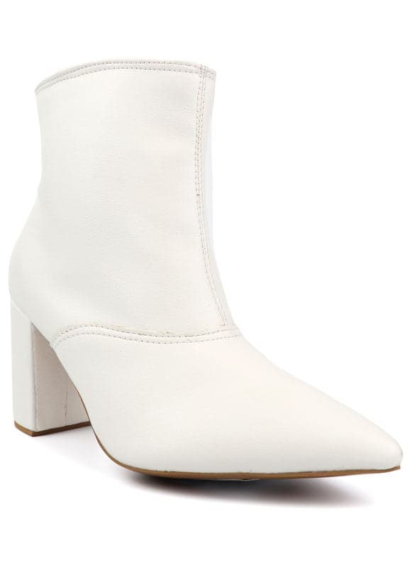 This pointed toe bootie is a chic and comfortable must have for fall. With its side zip closure, pointy toe and block heel this pair is ideal for your everyday needs. Pair it with your favorite look while the weather turns chilly! Avah Couture