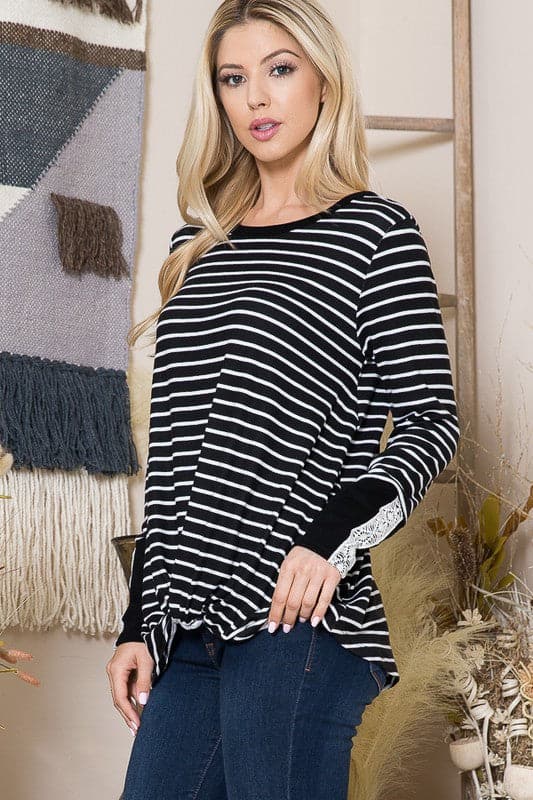 The Stripe Light Sweater is a cozy fall staple for every girl’s closet. With a relaxed fit and flattering twist front, this top can be styled with comfortable jeans or your favorite leggings. The lace trim sleeves add a romantic touch to the design, making it perfect for date night or an afternoon coffee date with friends.