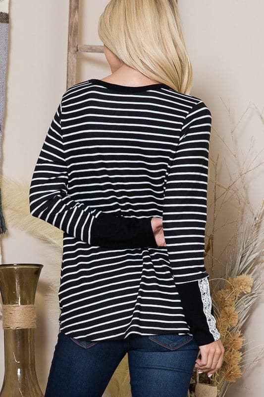 The Stripe Light Sweater is a cozy fall staple for every girl’s closet. With a relaxed fit and flattering twist front, this top can be styled with comfortable jeans or your favorite leggings. The lace trim sleeves add a romantic touch to the design, making it perfect for date night or an afternoon coffee date with friends.