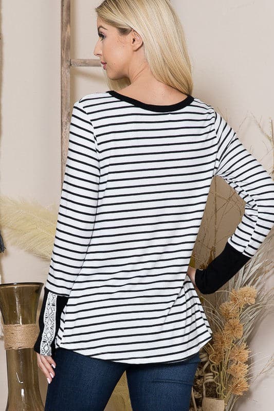 The Stripe Light Sweater is a cozy fall staple for every girl’s closet. With a relaxed fit and flattering twist front, this top can be styled with comfortable jeans or your favorite leggings. The lace trim sleeves add a romantic touch to the design, making it perfect for date night or an afternoon coffee date with friends.