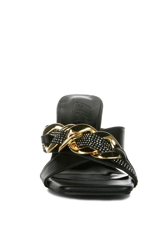 Give your look a unique touch of creativity with these stylish metallic chain-heeled sandals. The golden chain strap and head-turning diamante detail will give any outfit the right amount of edge and glamour. Chic, unique, and full of style. Avah Couture