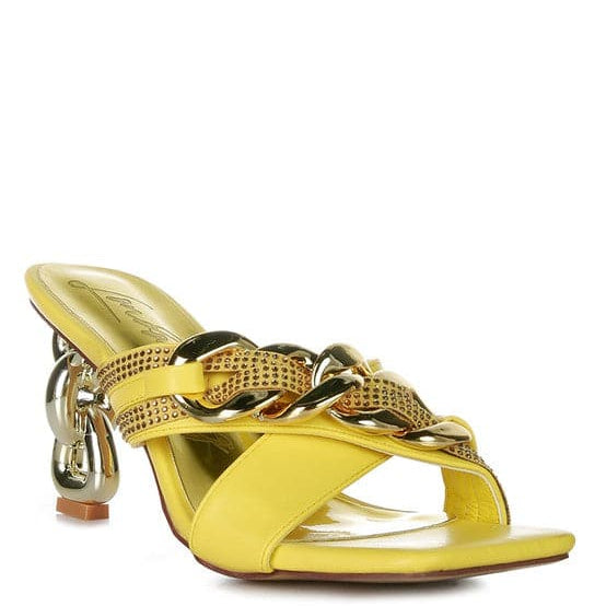 Give your look a unique touch of creativity with these stylish metallic chain-heeled sandals. The golden chain strap and head-turning diamante detail will give any outfit the right amount of edge and glamour. Chic, unique, and full of style. Avah Couture